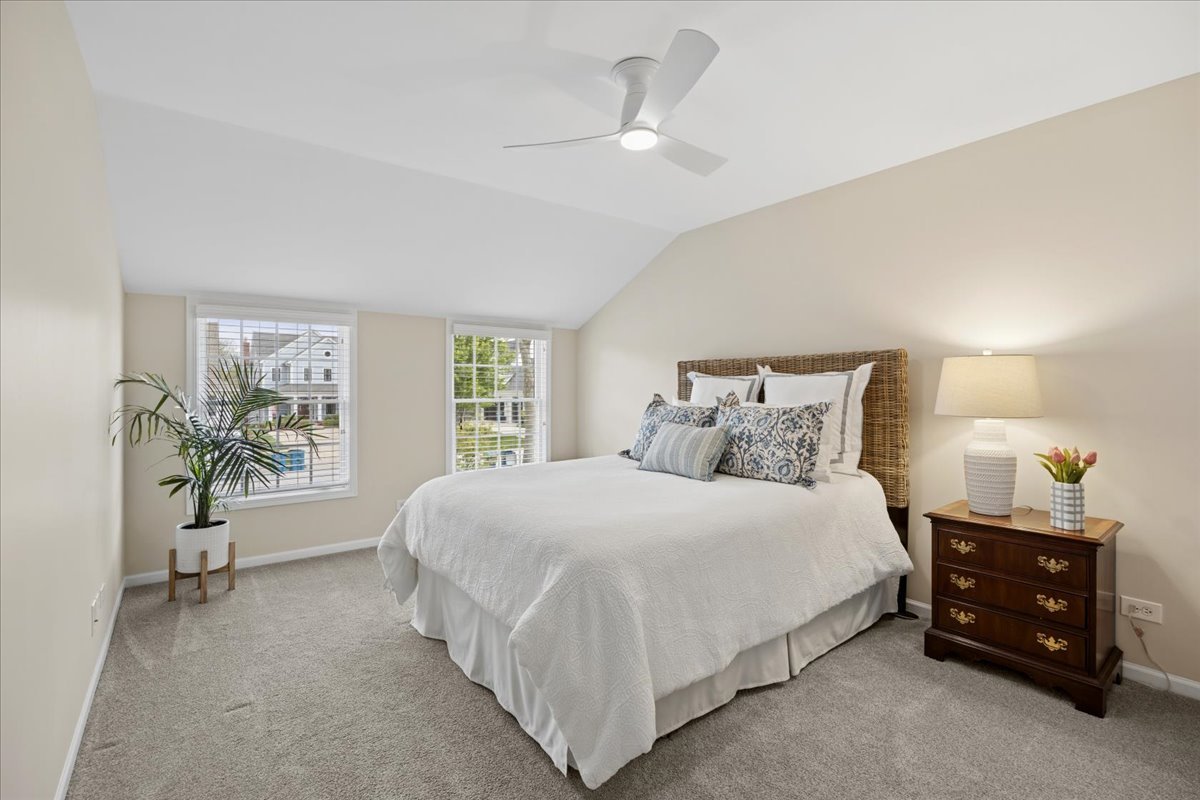 749 Summit Street Downers Grove, IL 60515 - Photo 15 of 32 a bedroom with a bed and a chandelier