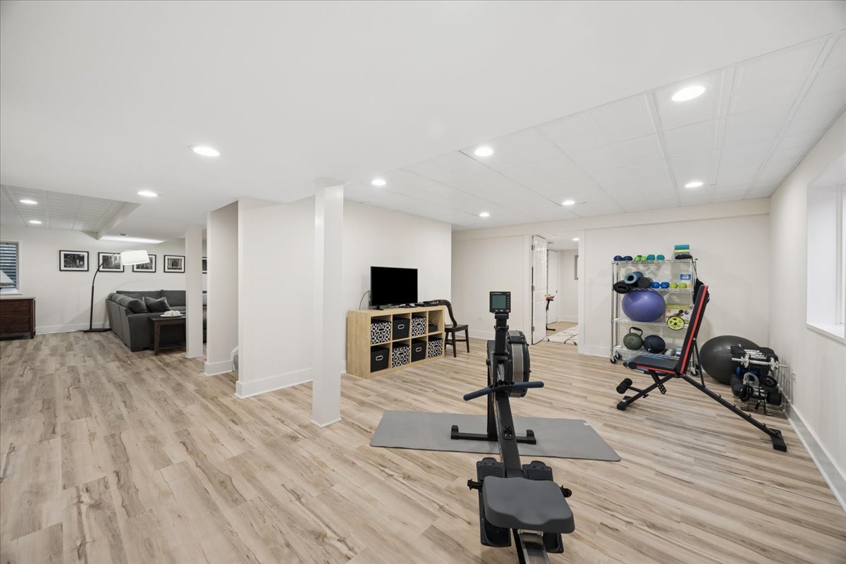 749 Summit Street Downers Grove, IL 60515 - Photo 25 of 32 a view of a room with gym equipment and a flat screen tv