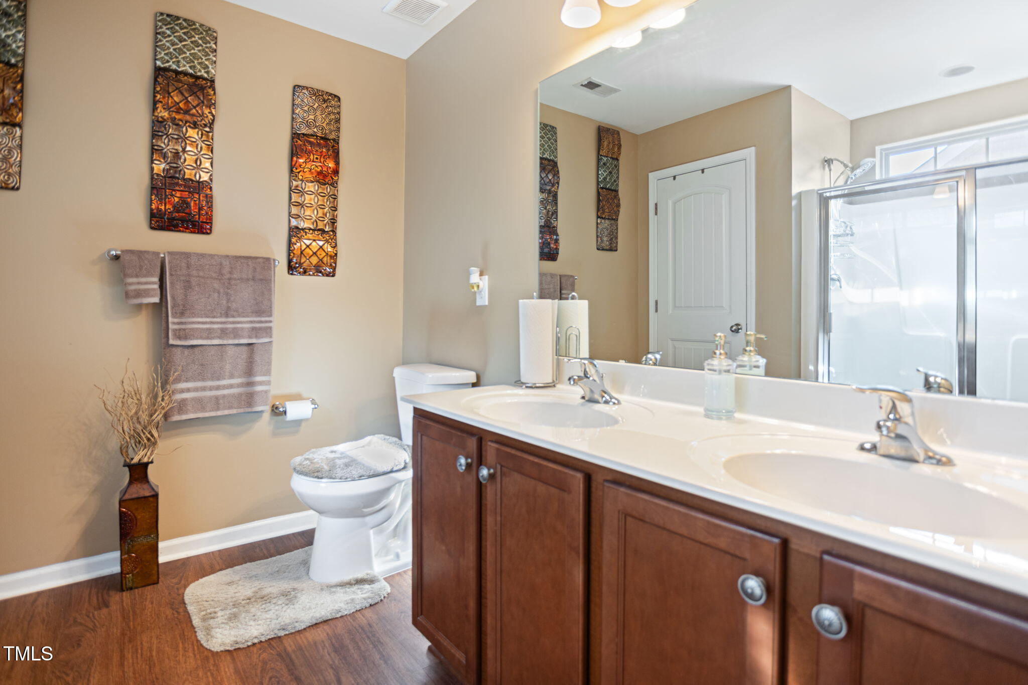 2517 Shepherd Valley Street Raleigh, NC 27610 - Photo 13 of 29 a bathroom with a granite countertop sink mirror vanity and toilet