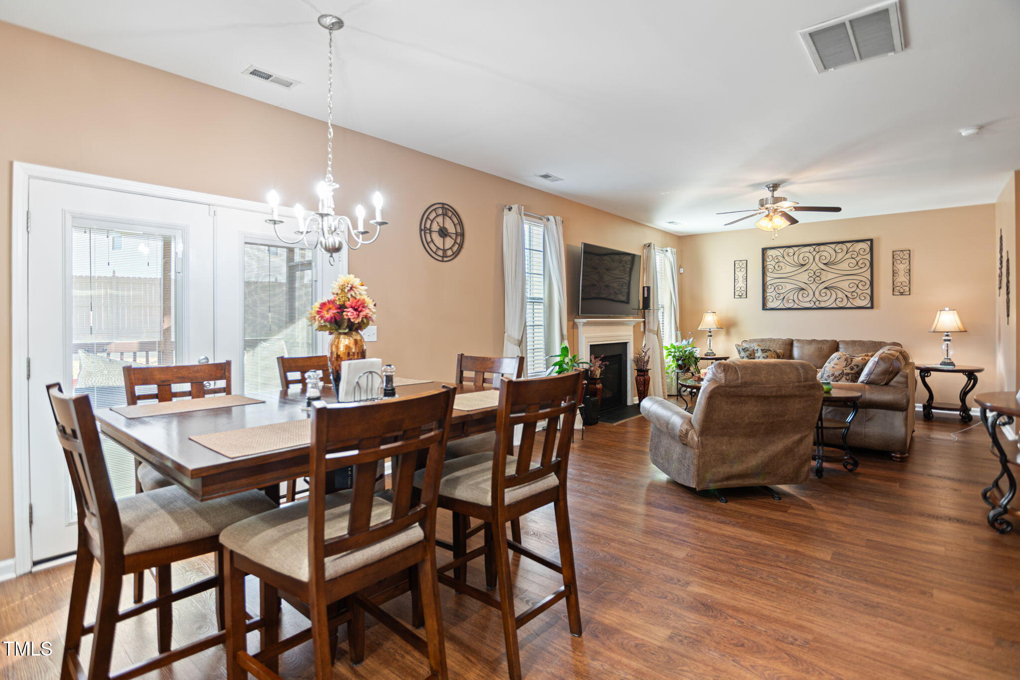 2517 Shepherd Valley Street Raleigh, NC 27610 - Photo 8 of 29 a view of a dining room with furniture wooden floor and chandelier