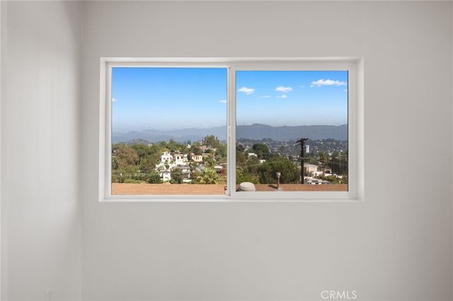 a view of a room that has a window