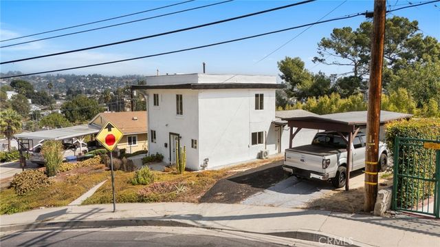 a view of a street with cars