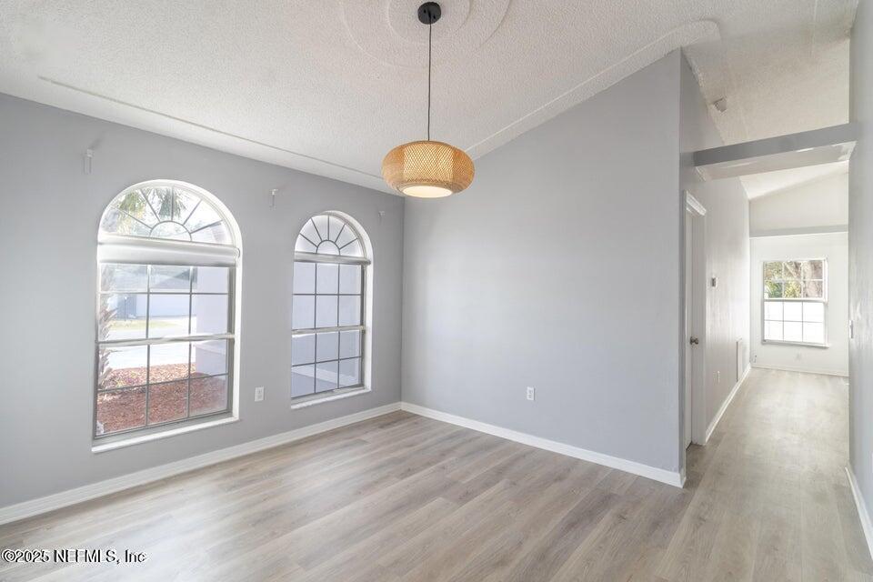 3955 Southwest 139th St Road Ocala, FL 34473 - Photo 17 of 45 an empty room with wooden floor and windows