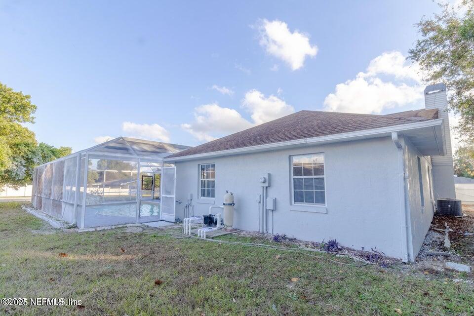 3955 Southwest 139th St Road Ocala, FL 34473 - Photo 31 of 45 a backyard of a house with table and chairs