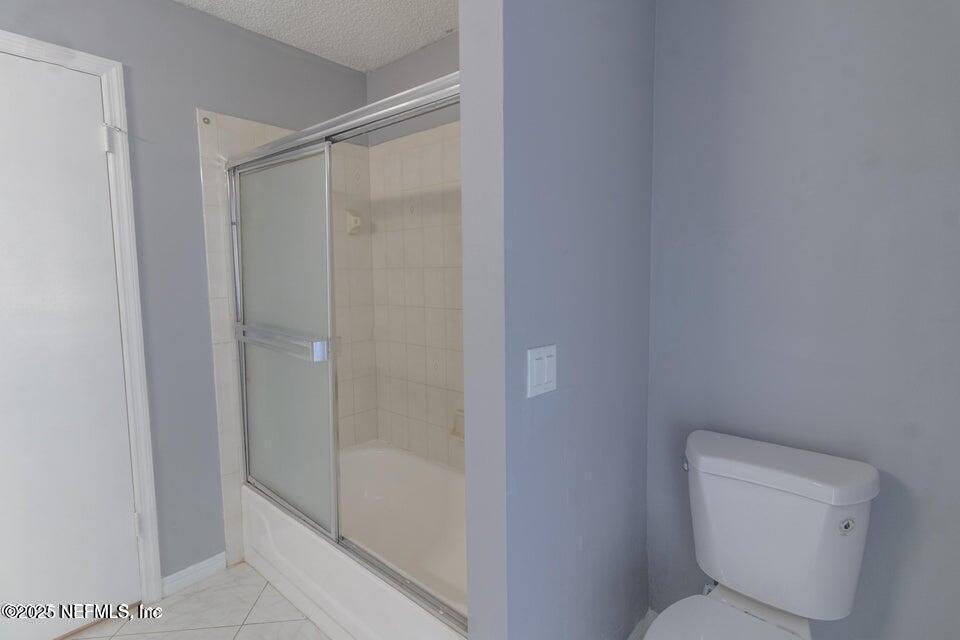 3955 Southwest 139th St Road Ocala, FL 34473 - Photo 44 of 45 a bathroom with a toilet and shower