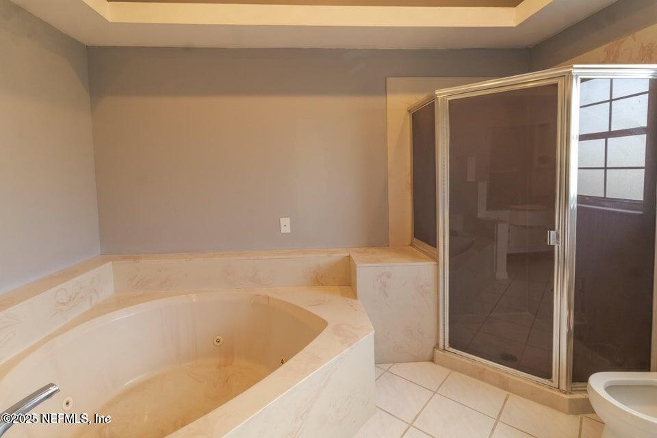 3955 Southwest 139th St Road Ocala, FL 34473 - Photo 45 of 45 a bathroom with a bathtub and a shower