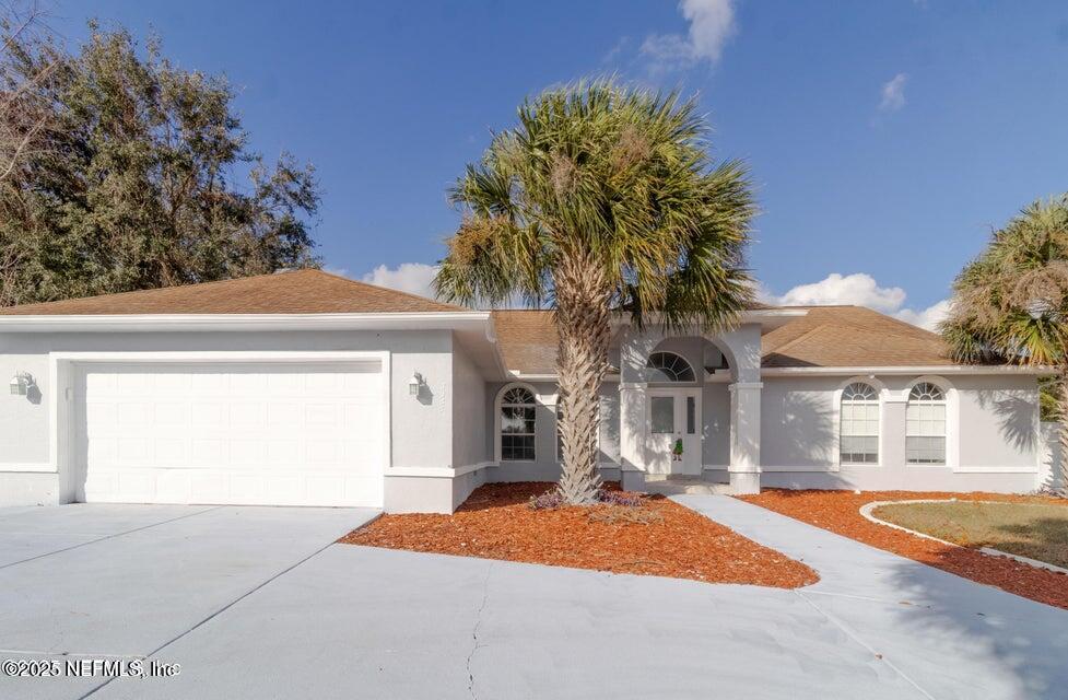 3955 Southwest 139th St Road Ocala, FL 34473 - Photo 6 of 45 a front view of a house with a yard