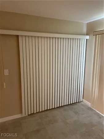 a view of swimming pool with lake and houses in the back