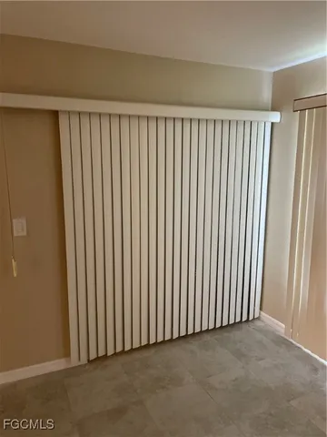 a view of swimming pool with lake and houses in the back