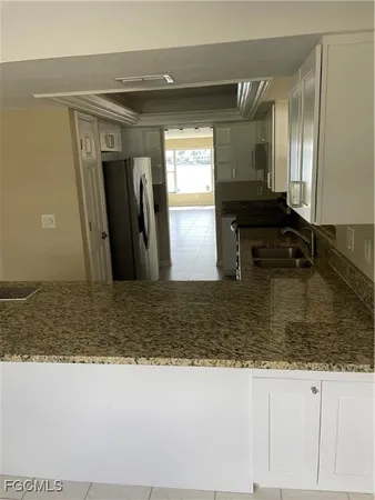 a bedroom with a bed and cabinets