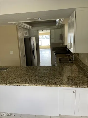 a bedroom with a bed and cabinets