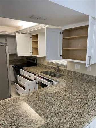 a view of a refrigerator in kitchen