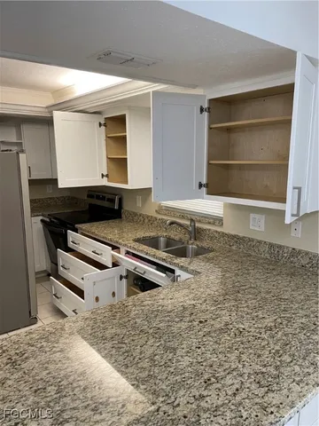 a view of a refrigerator in kitchen
