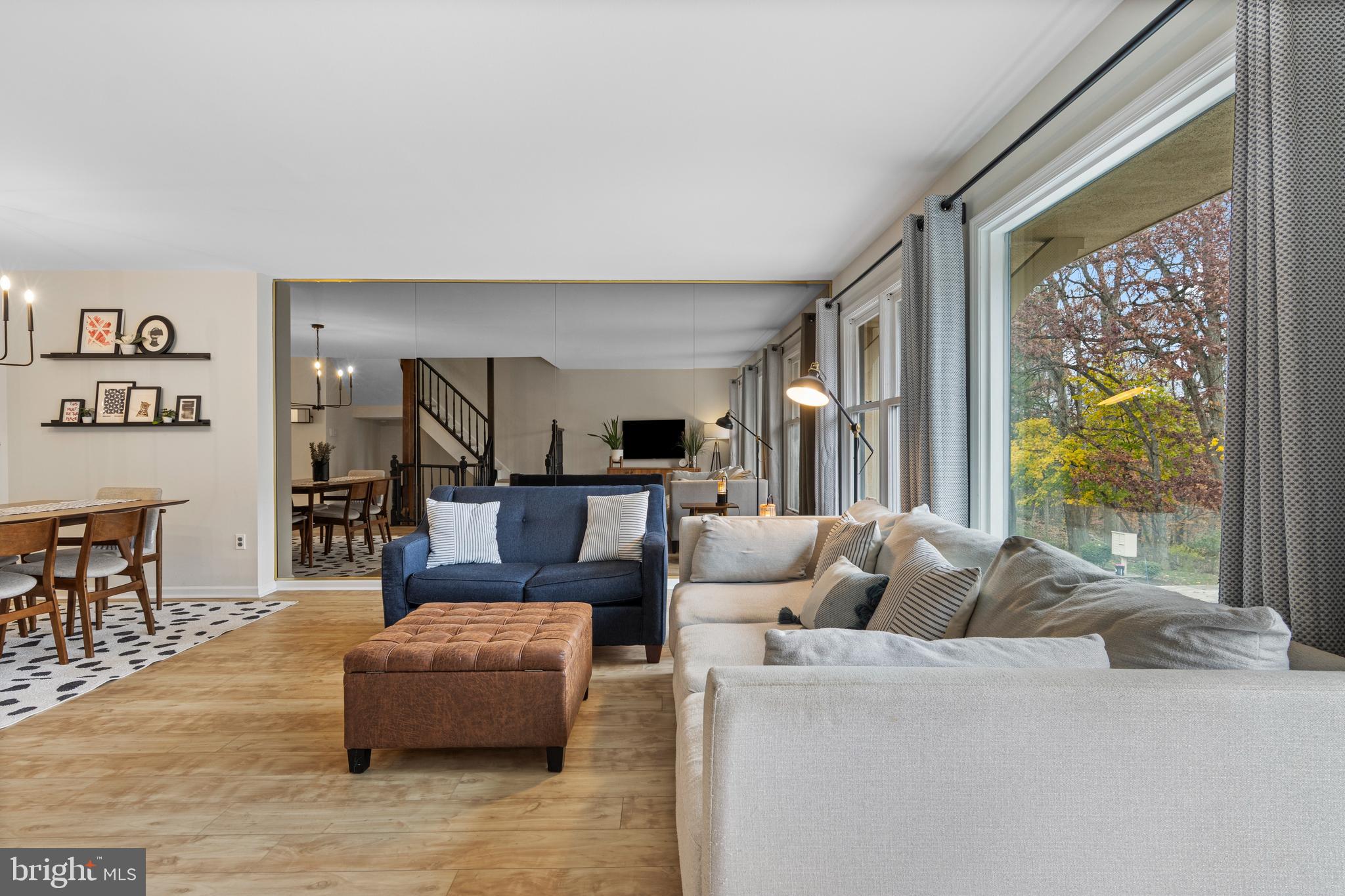 649 Niblick Lane, Unit 20 Wallingford, PA 19086 - Photo 11 of 35 a living room with furniture and a large window