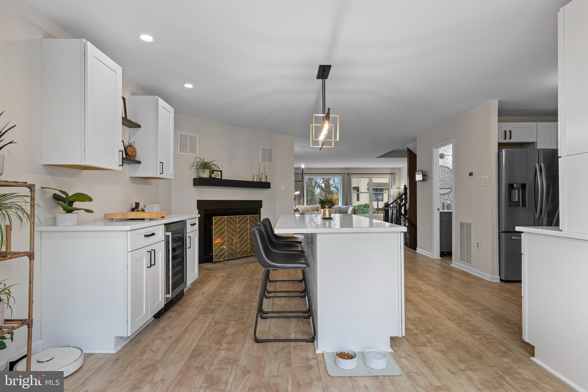 649 Niblick Lane, Unit 20 Wallingford, PA 19086 - Photo 16 of 35 a kitchen with a refrigerator in it and white cabinets