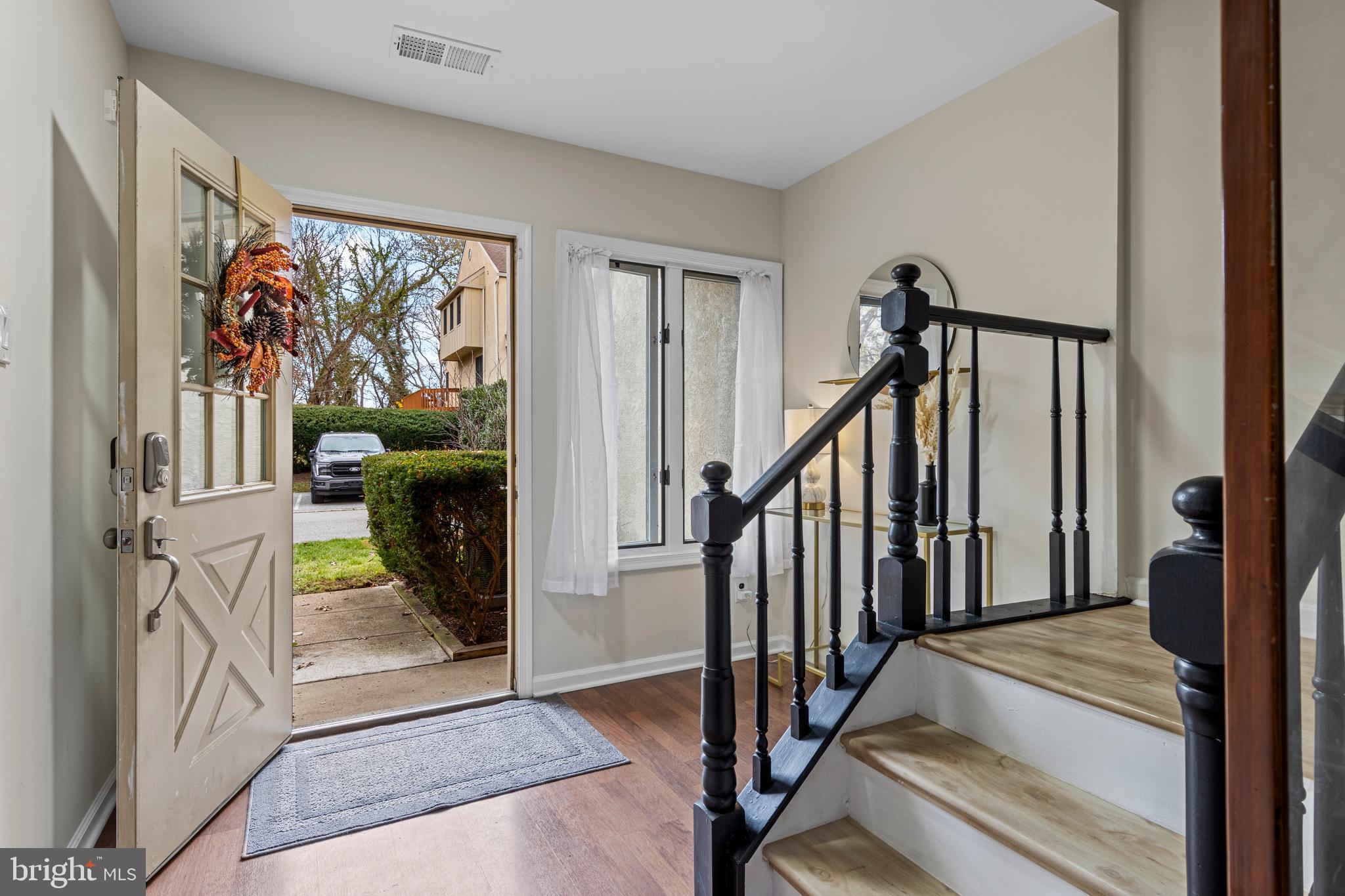 649 Niblick Lane, Unit 20 Wallingford, PA 19086 - Photo 3 of 35 a view of a hallway with wooden floor and staircase