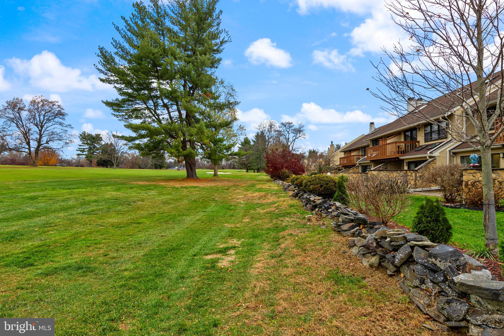649 Niblick Lane, Unit 20 Wallingford, PA 19086 - Photo 35 of 35 a backyard of a house with lots of green space