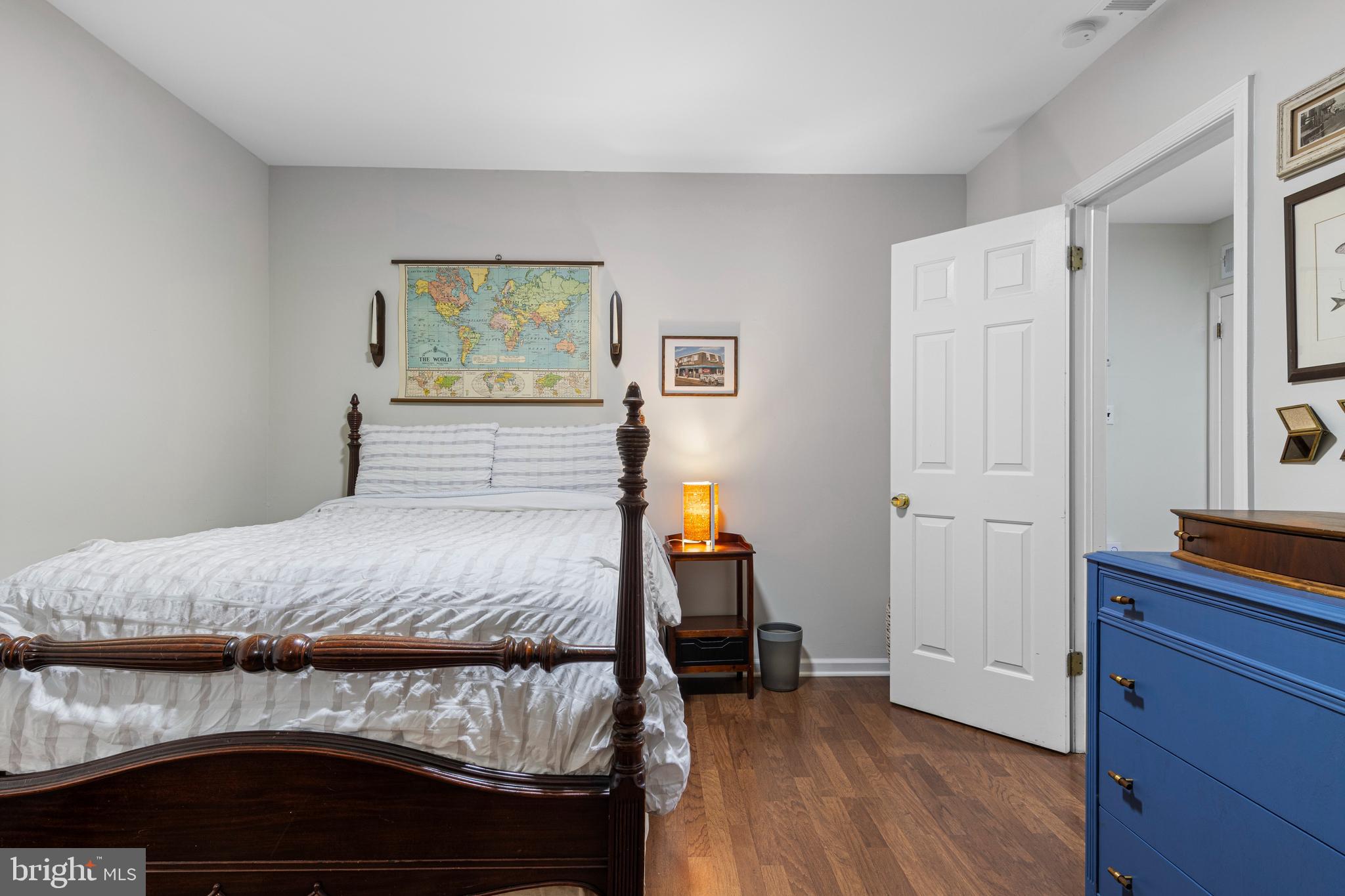 649 Niblick Lane, Unit 20 Wallingford, PA 19086 - Photo 4 of 35 a bedroom with a bed and wooden floor