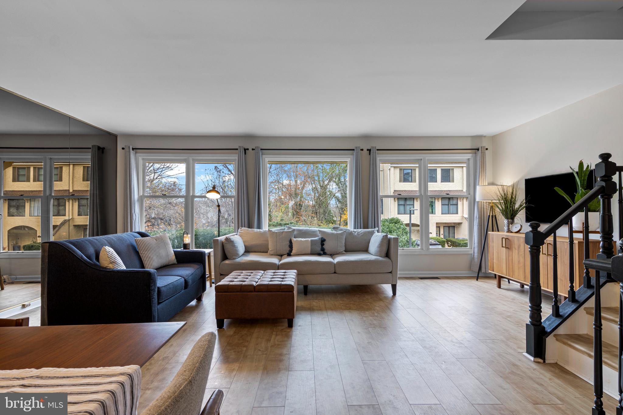 649 Niblick Lane, Unit 20 Wallingford, PA 19086 - Photo 8 of 35 a living room with fireplace furniture and a wooden floor