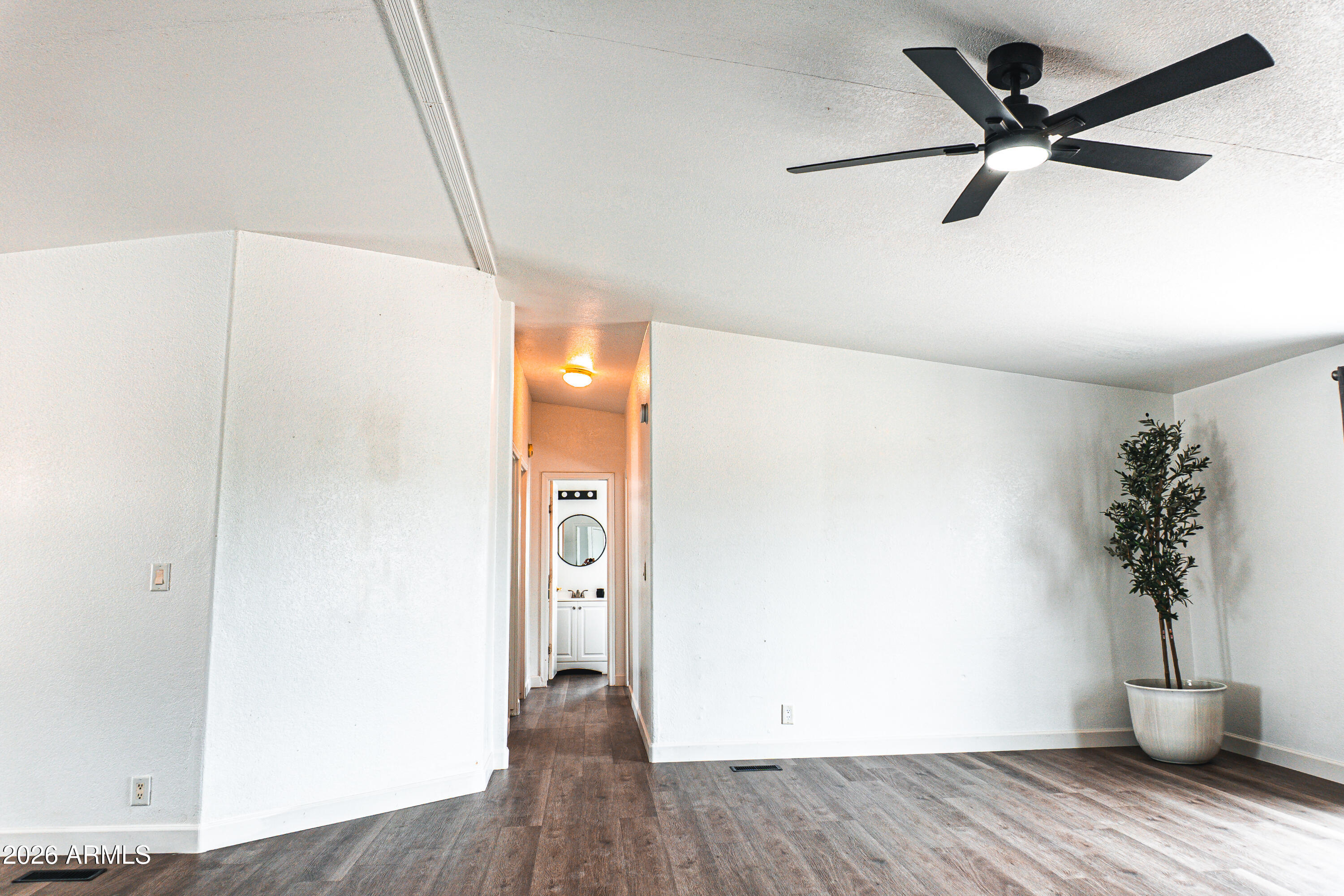 18633 West Rustler Road Buckeye, AZ 85326 - Photo 19 of 52 hallway to additional bedrooms