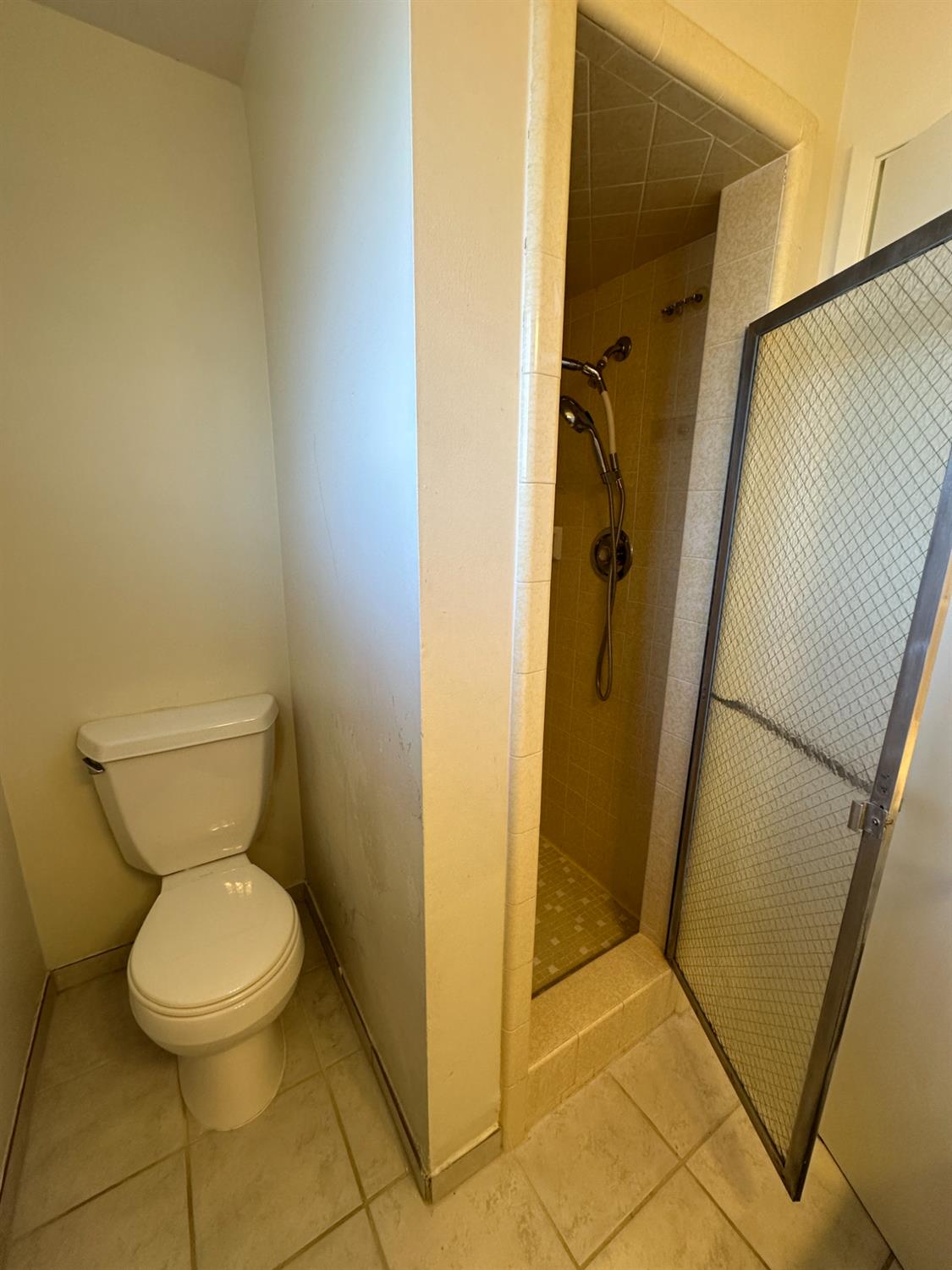 91 O Street Sanger, CA 93657 - Photo 19 of 21 a bathroom with a toilet and a shower