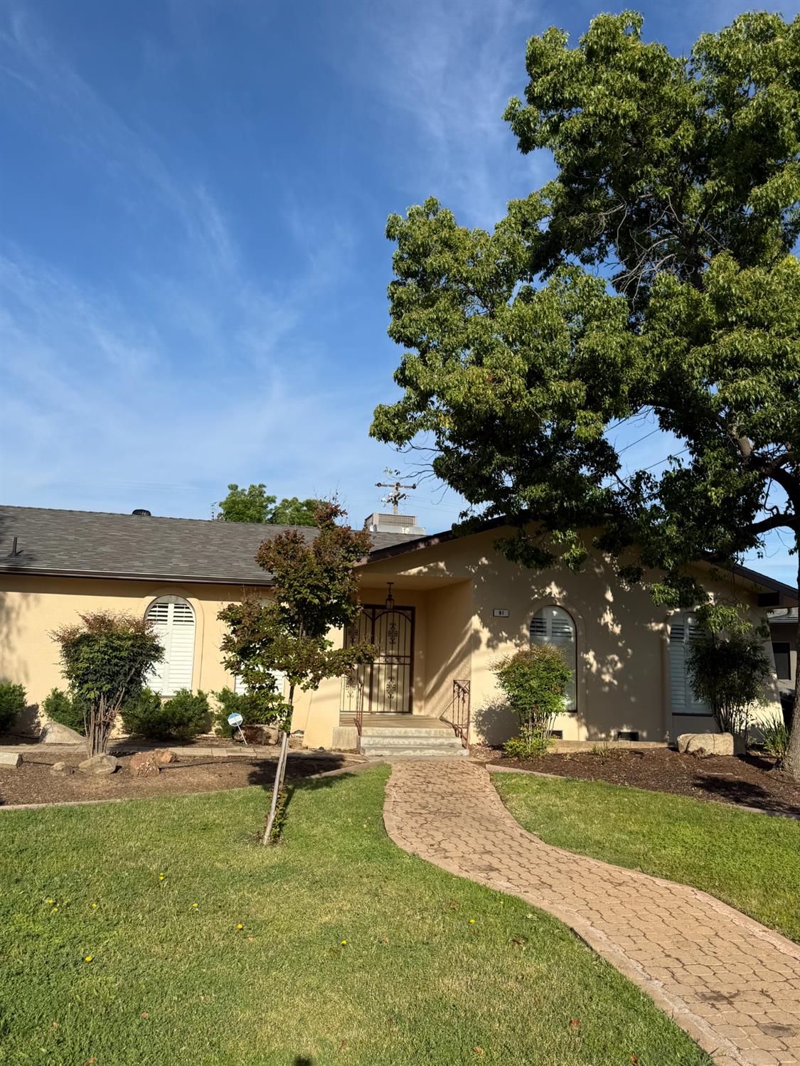 91 O Street Sanger, CA 93657 - Photo 2 of 21 a view of a park with large trees
