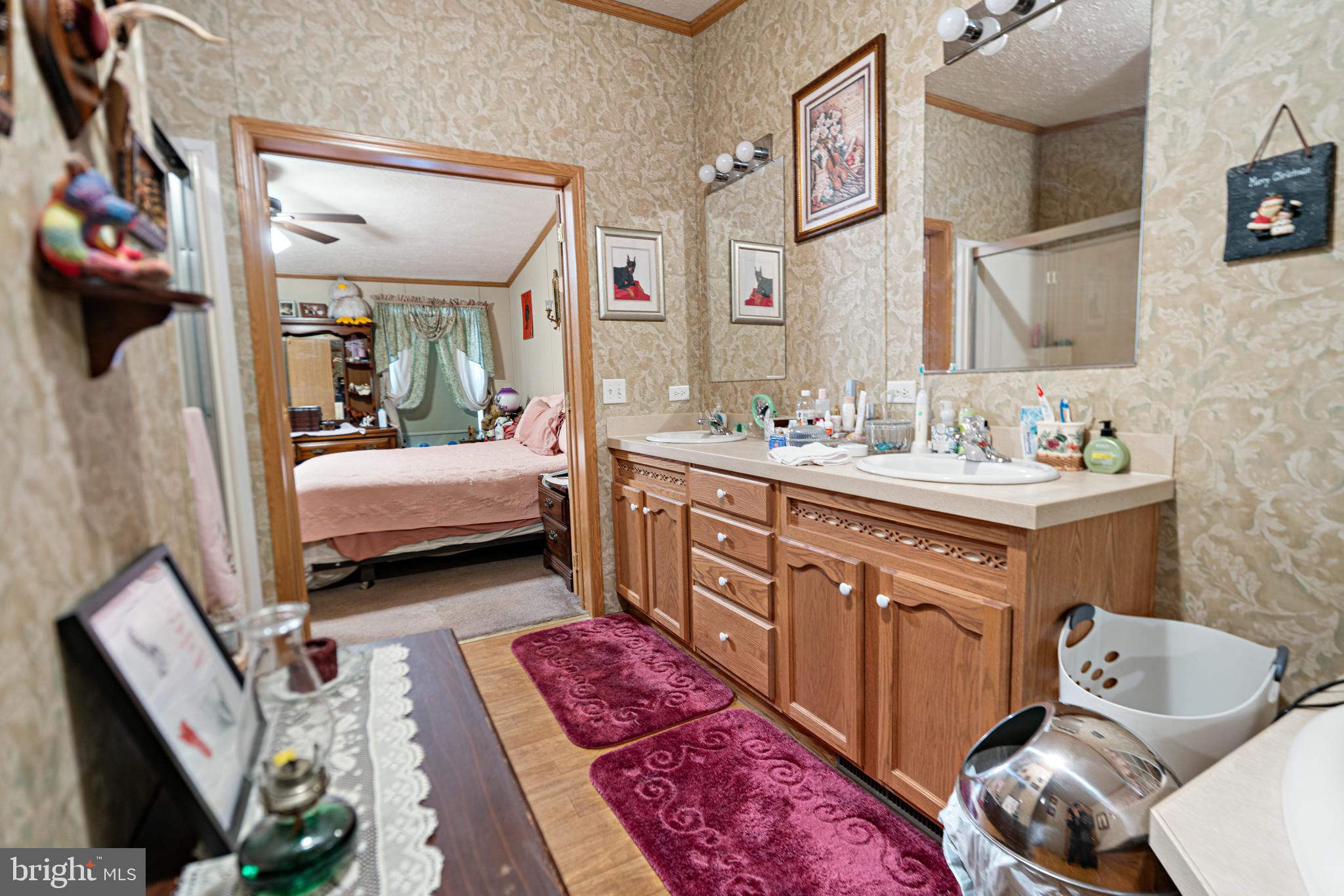 701 Cassel Road, Unit 107 Manchester, PA 17345 - Photo 13 of 21 a en suite bathroom with a double vanity sink and a mirror