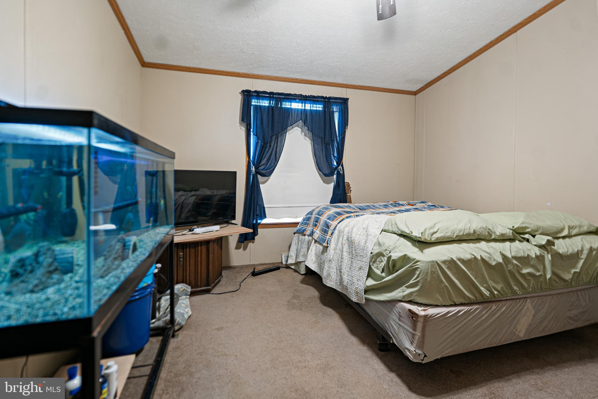 701 Cassel Road, Unit 107 Manchester, PA 17345 - Photo 14 of 21 a bedroom with a bed and a mirror