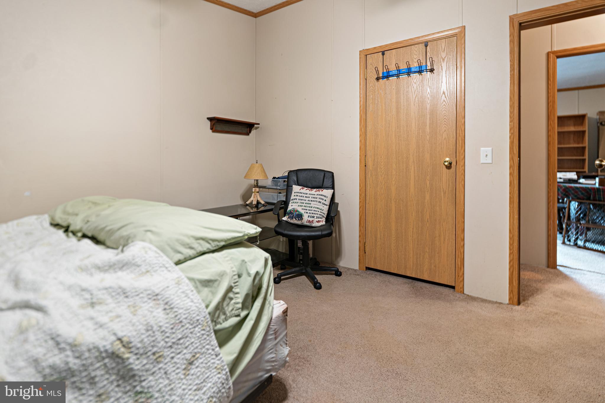 701 Cassel Road, Unit 107 Manchester, PA 17345 - Photo 15 of 21 a bedroom with a bed and a table in it