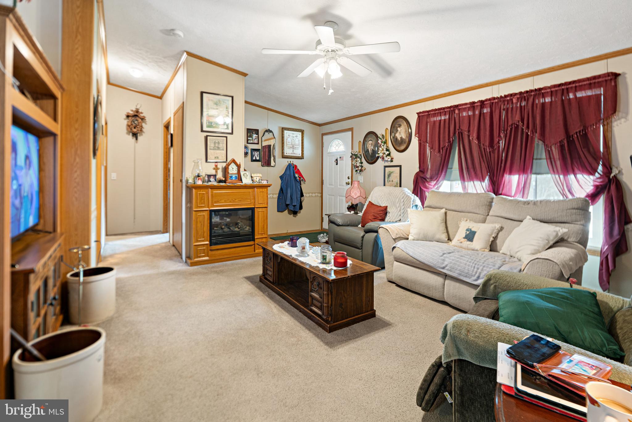 701 Cassel Road, Unit 107 Manchester, PA 17345 - Photo 4 of 21 a living room with furniture a fireplace and a flat screen tv