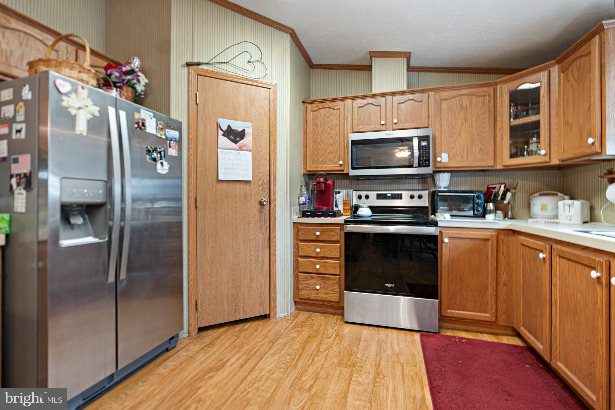 701 Cassel Road, Unit 107 Manchester, PA 17345 - Photo 7 of 21 a kitchen with granite countertop a refrigerator stove and microwave