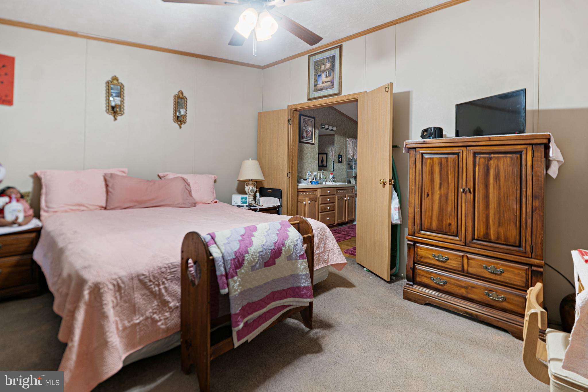 701 Cassel Road, Unit 107 Manchester, PA 17345 - Photo 9 of 21 a bedroom with a bed and a flat screen tv