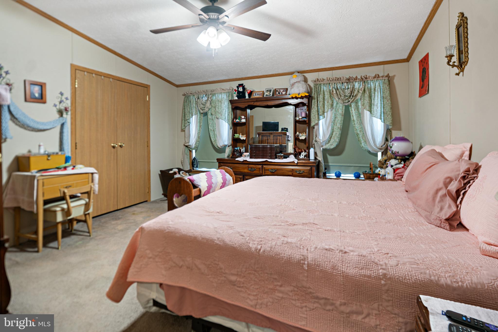 701 Cassel Road, Unit 107 Manchester, PA 17345 - Photo 10 of 21 a bedroom with a bed and a chandelier