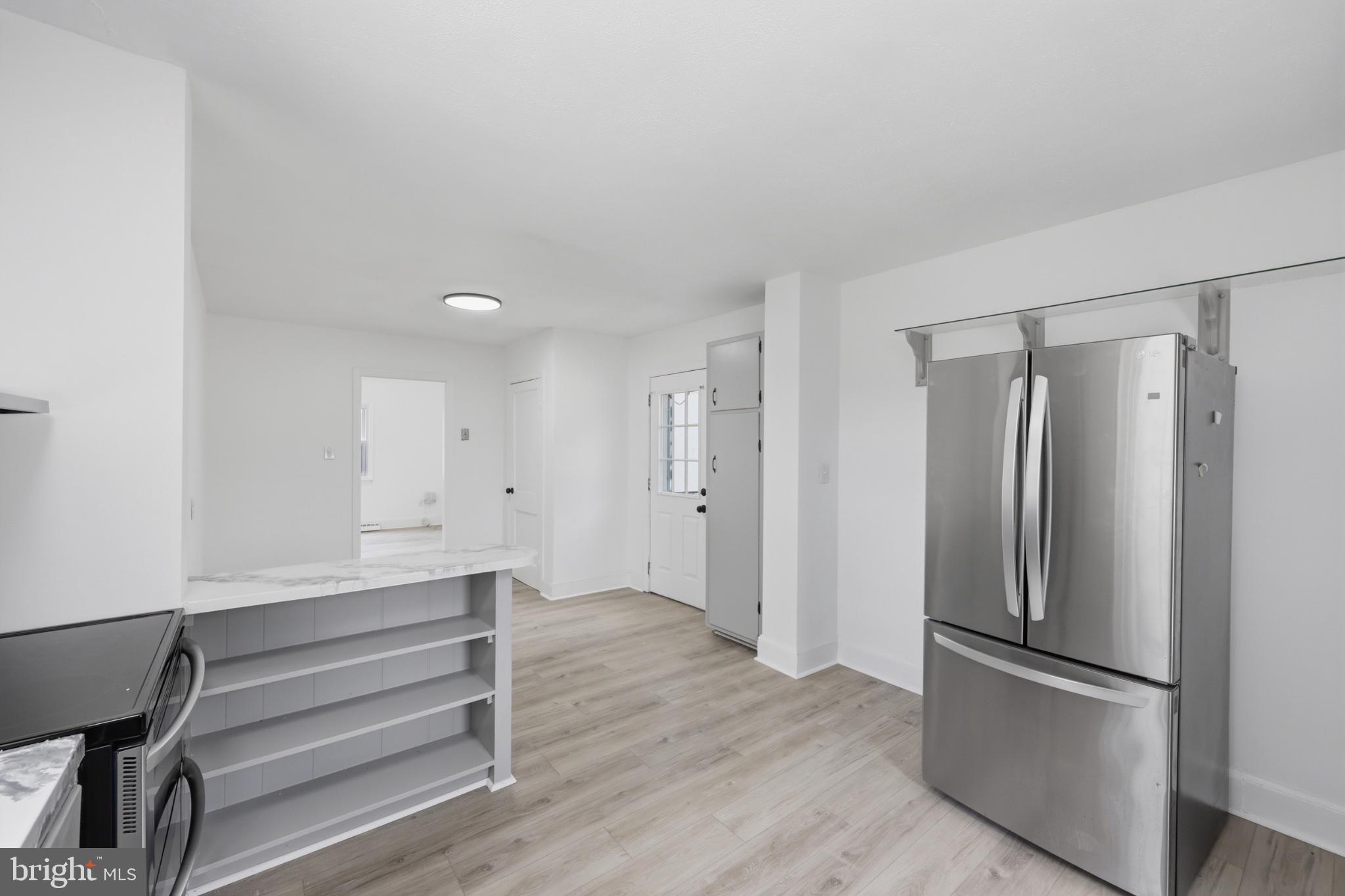 8251 Marshall Corner Road Pomfret, MD 20675 - Photo 7 of 20 Modern kitchen with sleek appliances.