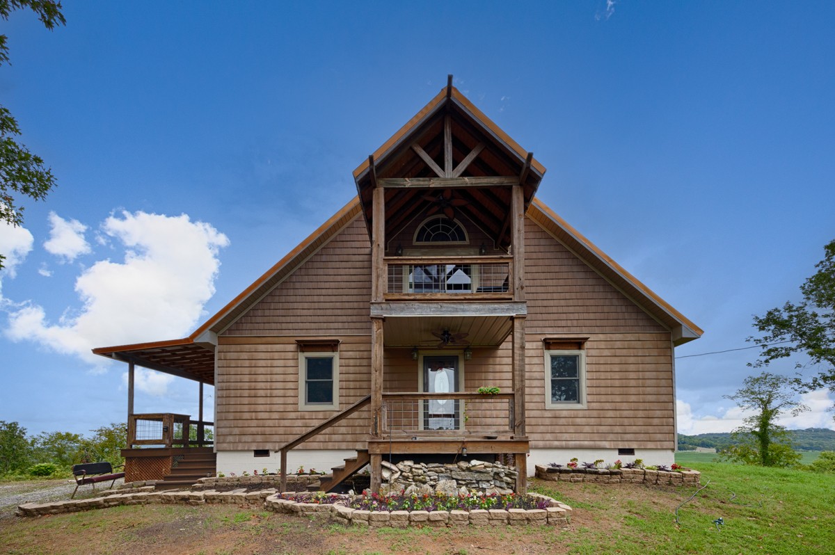 375 Kelley Road Prospect, TN 38477 - Photo 1 of 42 a front view of a house with garden