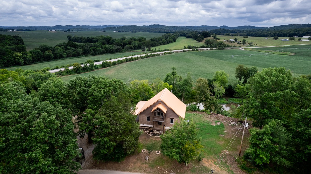375 Kelley Road Prospect, TN 38477 - Photo 37 of 42 an aerial view of a house with yard and green space