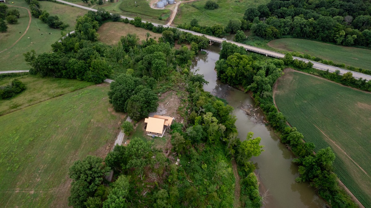 375 Kelley Road Prospect, TN 38477 - Photo 39 of 42 an aerial view of green landscape with trees houses and lake view