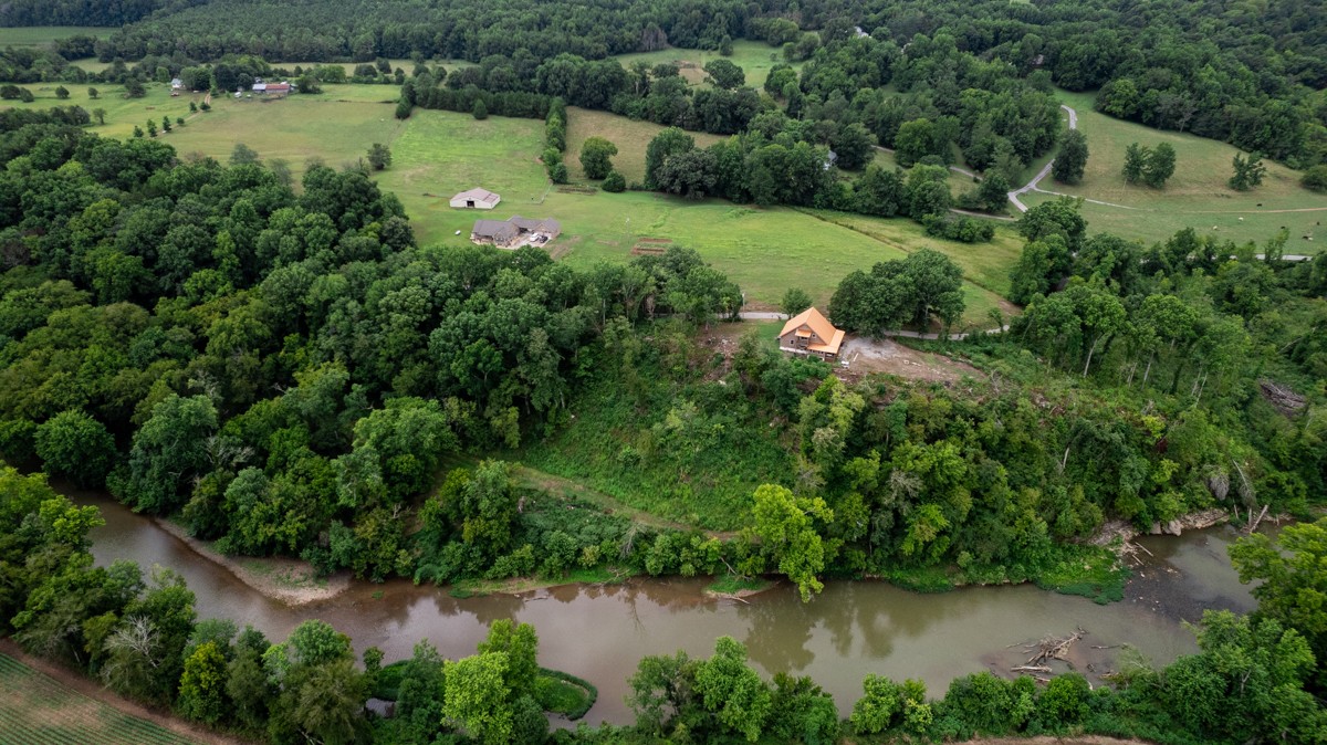 375 Kelley Road Prospect, TN 38477 - Photo 41 of 42 an aerial view of green landscape with trees houses and lake view