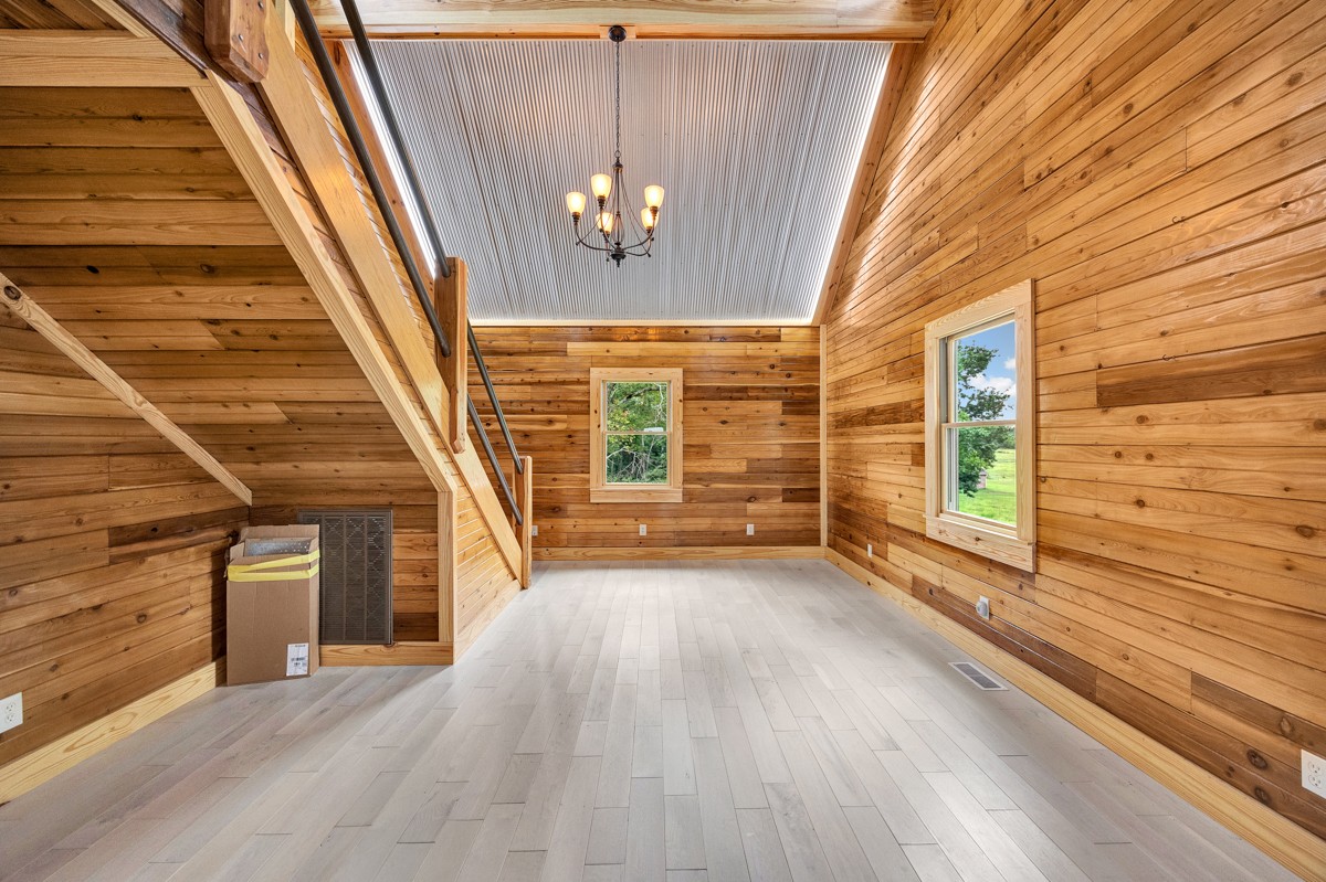375 Kelley Road Prospect, TN 38477 - Photo 5 of 42 a view of a livingroom with wooden floor and stairs