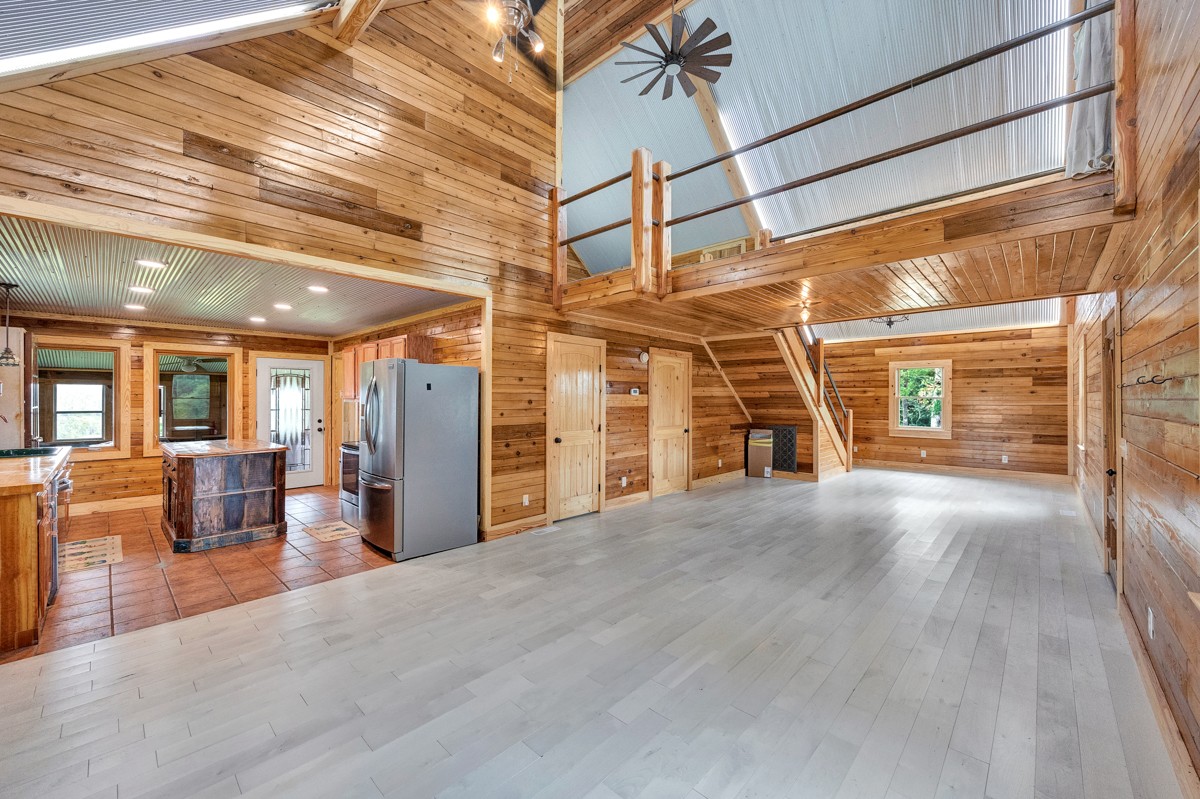 375 Kelley Road Prospect, TN 38477 - Photo 6 of 42 a view of a livingroom with furniture staircase and a ceiling fan