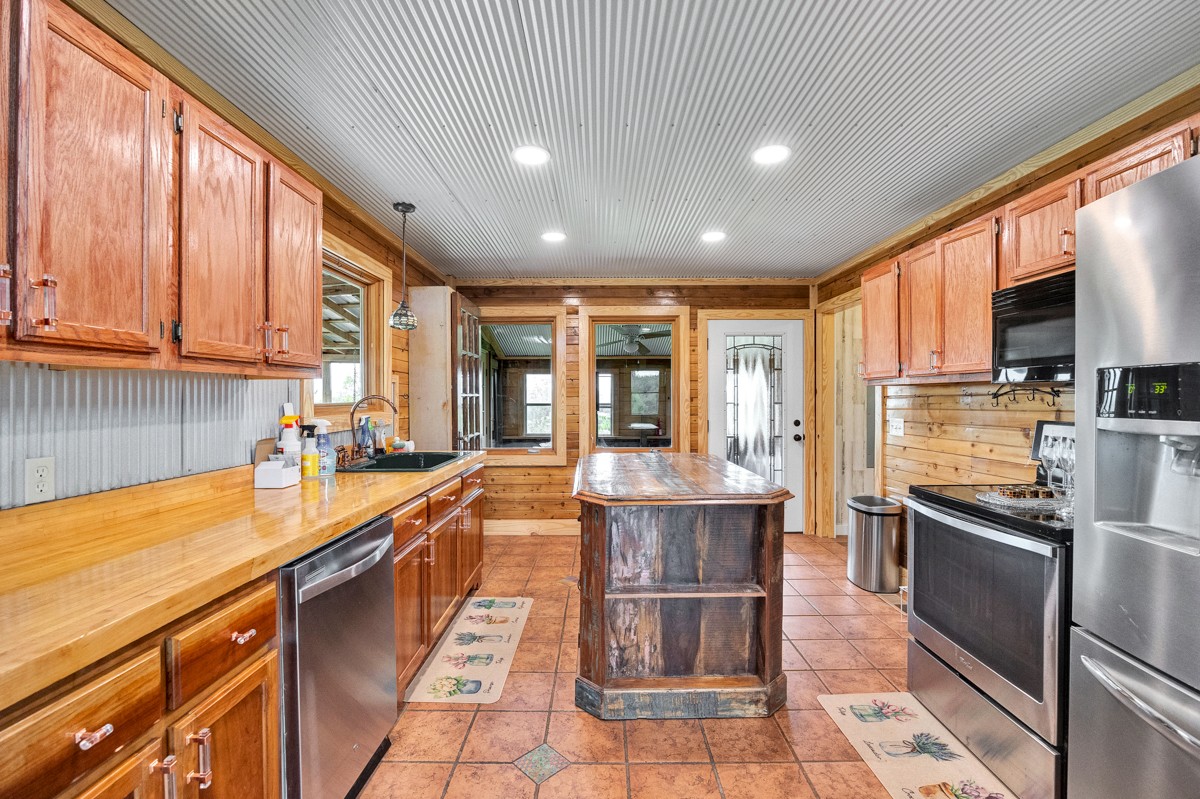 375 Kelley Road Prospect, TN 38477 - Photo 8 of 42 a large kitchen with granite countertop lots of counter space and sink