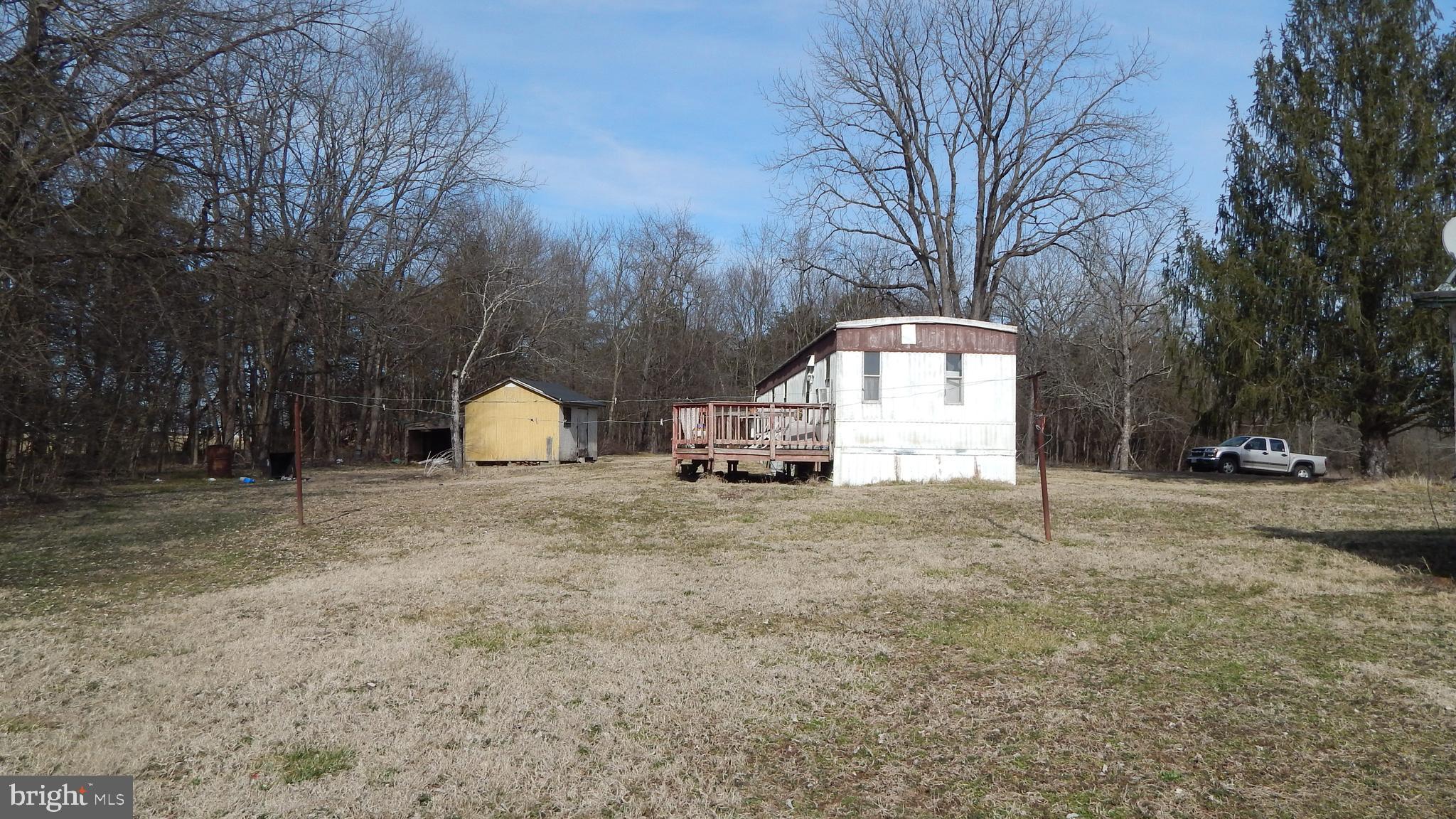 20470 Blackjack Road Culpeper, VA 22701 - Photo 5 of 7 a house with trees in the background
