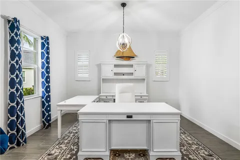 a dining room with a table and chairs