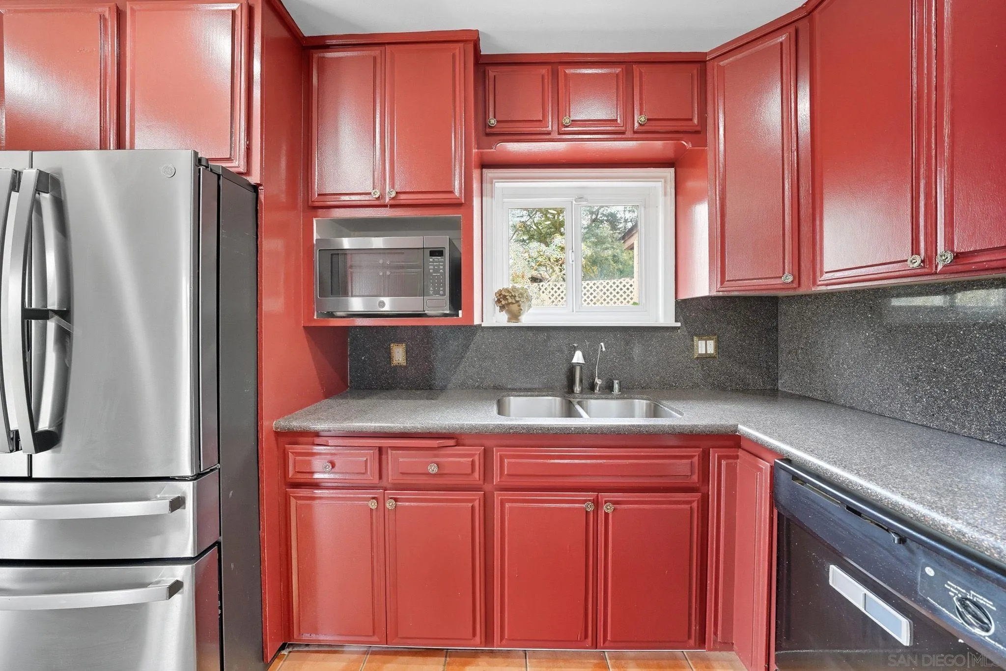 321 North Lane El Cajon, CA 92021 - Photo 12 of 44 a kitchen with stainless steel appliances granite countertop a refrigerator and a stove top oven