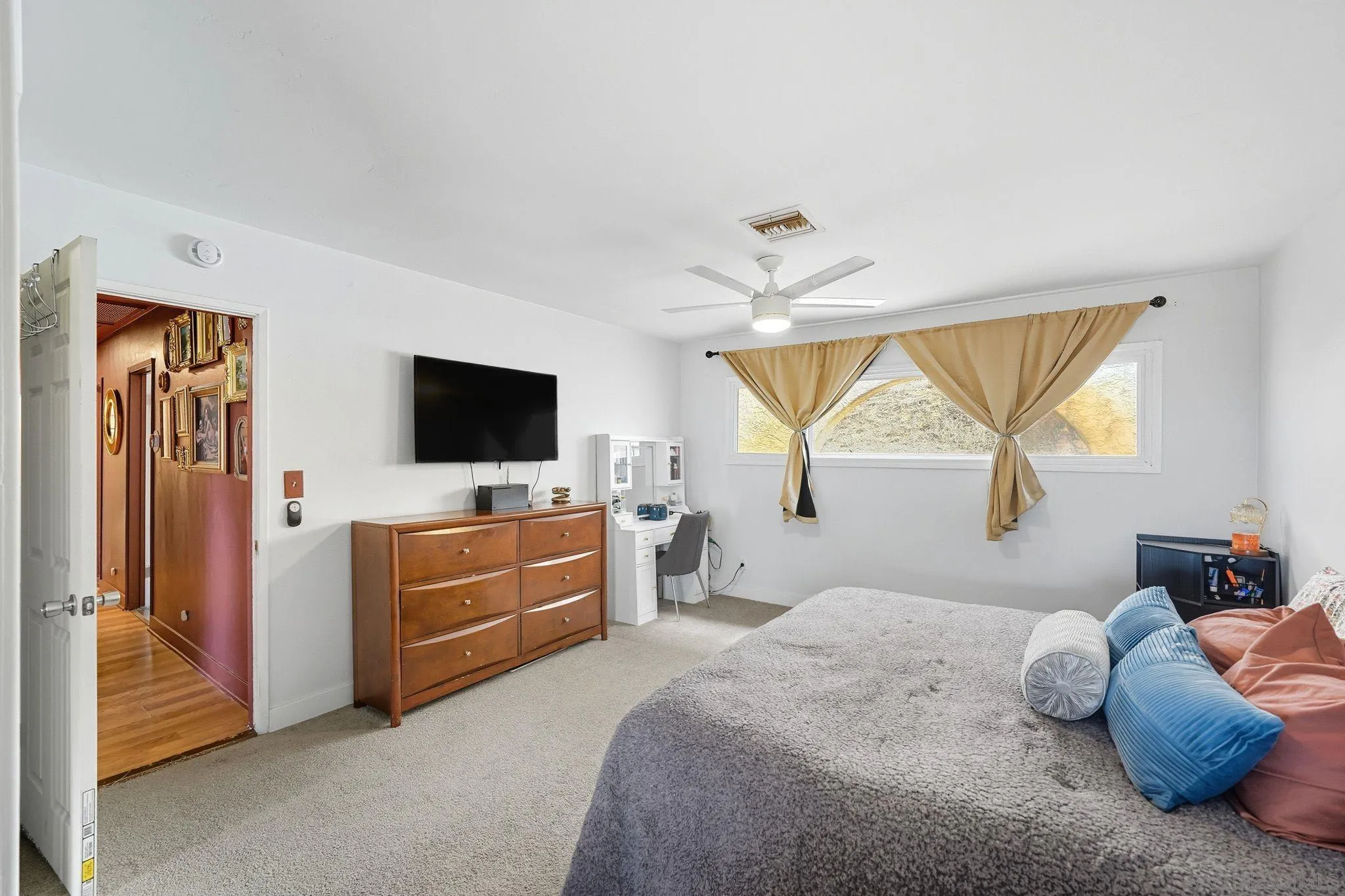 321 North Lane El Cajon, CA 92021 - Photo 23 of 44 a bedroom with a bed and a flat screen tv