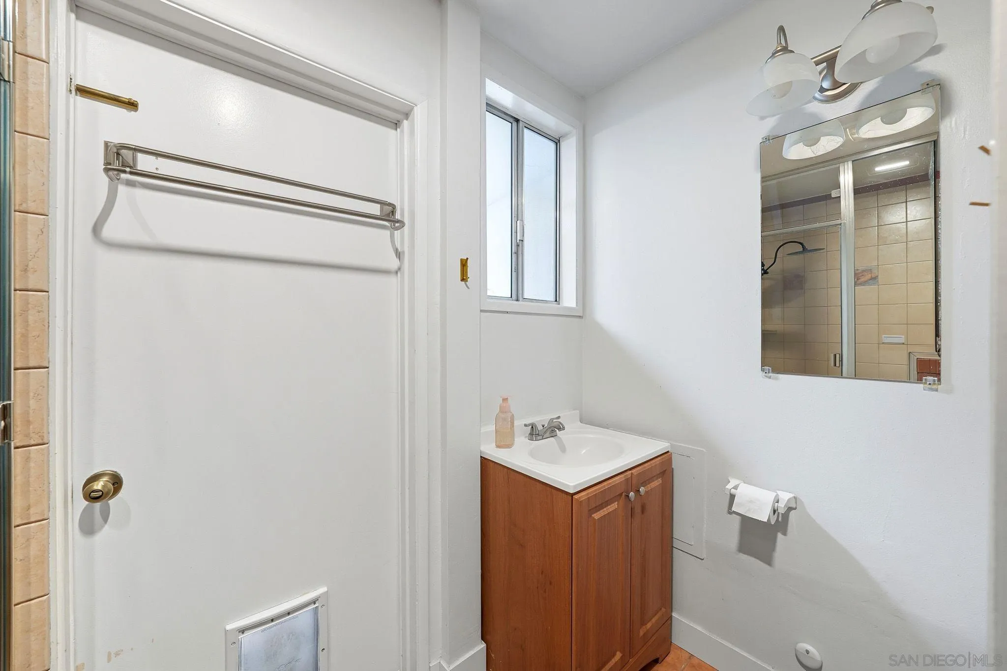 321 North Lane El Cajon, CA 92021 - Photo 28 of 44 a bathroom with a bathtub shower sink vanity and mirror