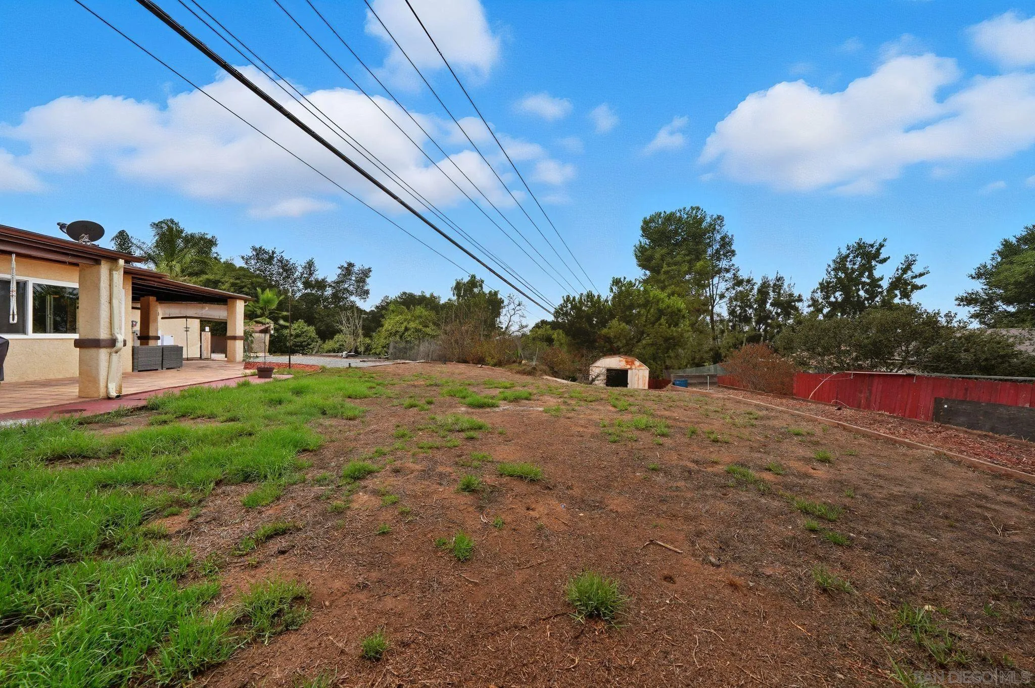 321 North Lane El Cajon, CA 92021 - Photo 39 of 44 a backyard of a house with table and chairs