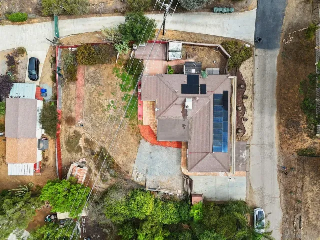 an aerial view of residential house with outdoor space and parking