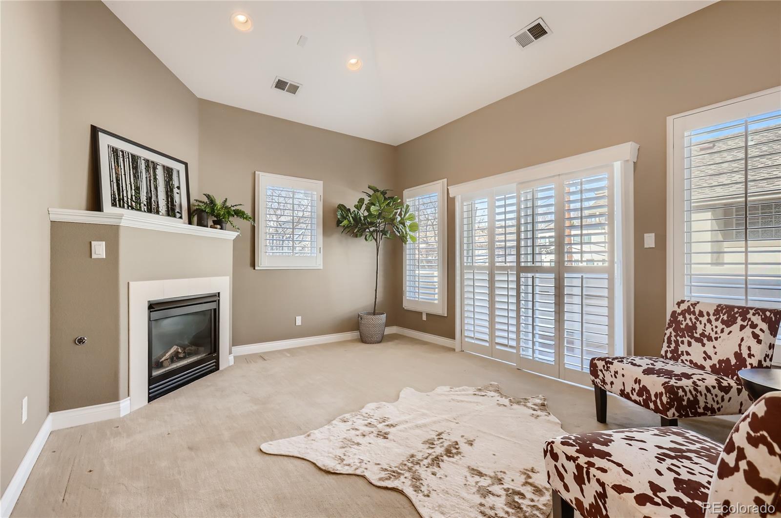 445 Jackson Street Denver, CO 80206 - Photo 15 of 29 a bedroom with furniture and a fireplace