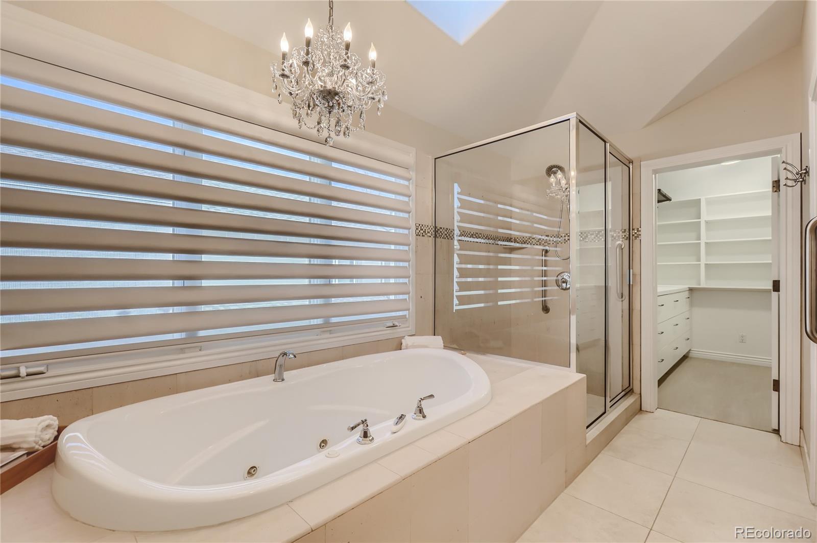 445 Jackson Street Denver, CO 80206 - Photo 16 of 29 a bathroom with a bathtub and shower